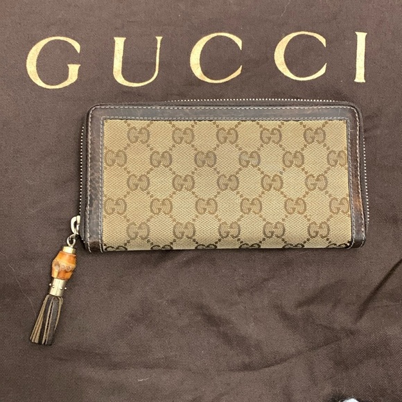 Gucci Handbags - Authentic Gucci leather trim GG monogram bamboo tassel long wallet